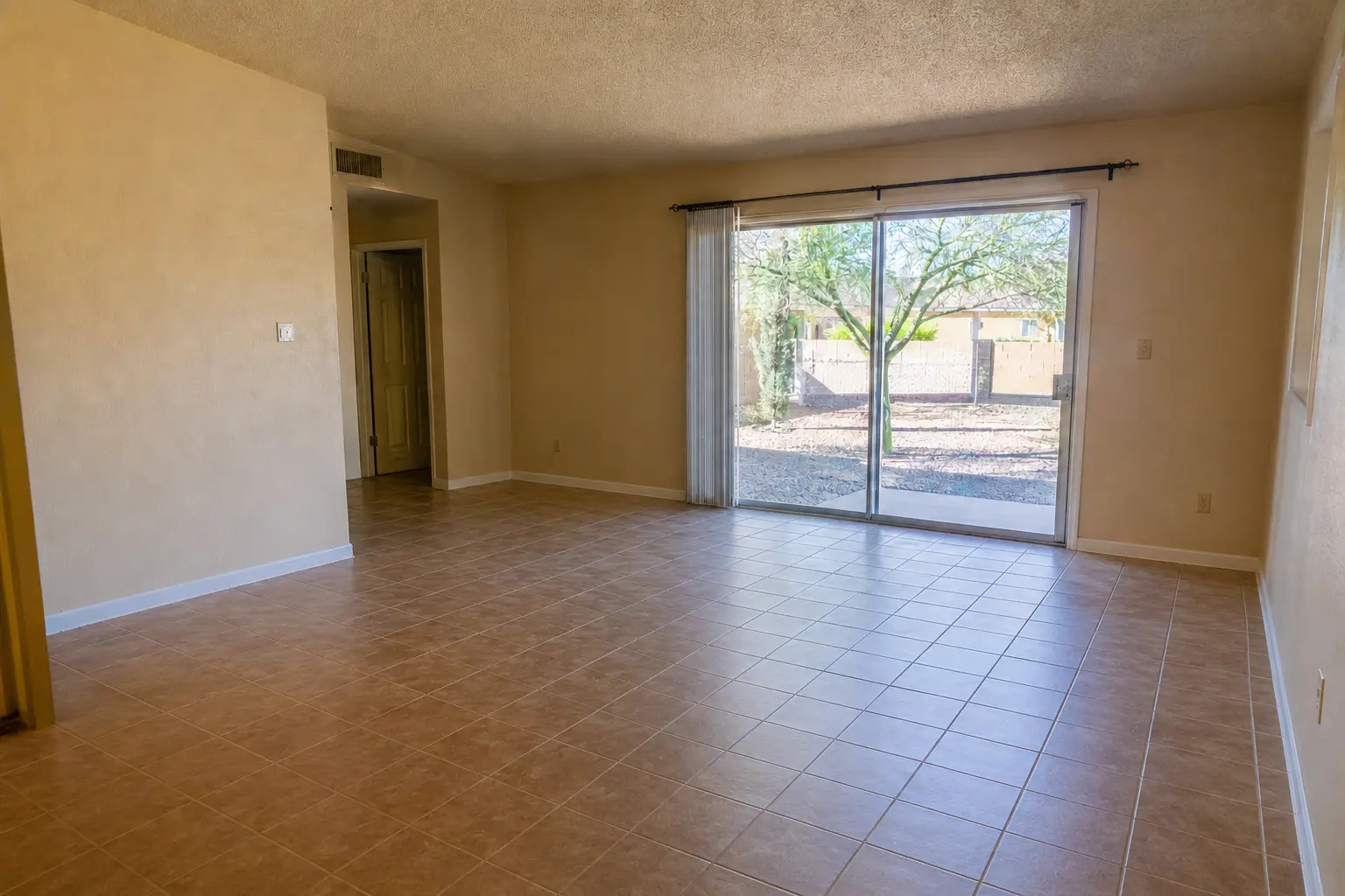 Illustrative after image of the same Phoenix rental living room cleared and ready for its next use
